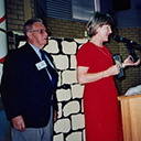 Headmistress Kay Patterson displaying the book and Certificate of Appreciation.