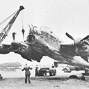 Recovery - Very bent, and with engine air intakes filled with earth, an early 
Lanc, R5845 of 1660 Conversion Unit, Swinderby, is lifted ready for the recover trolley 
by a crew of 58 MU.