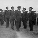 Final Parade inspection of 460 squadron "Menzie's Blue Orchids", nicknamed by the Army, but very proud to wear the uniform, led by Air Vice Marshal Wrigley C/O. RAAF England, followed by Squadron Commander Wing Commander Swann, DSO, DFC, then Wing Commander Frank Lawrence, DFC, DFM and other distinguished officers, East Kirkby 460 Squadron October, 1945.